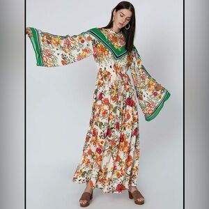 Iconic Floral Printed Maxi A-line Dress with Flared Sleeves and Tie Up.